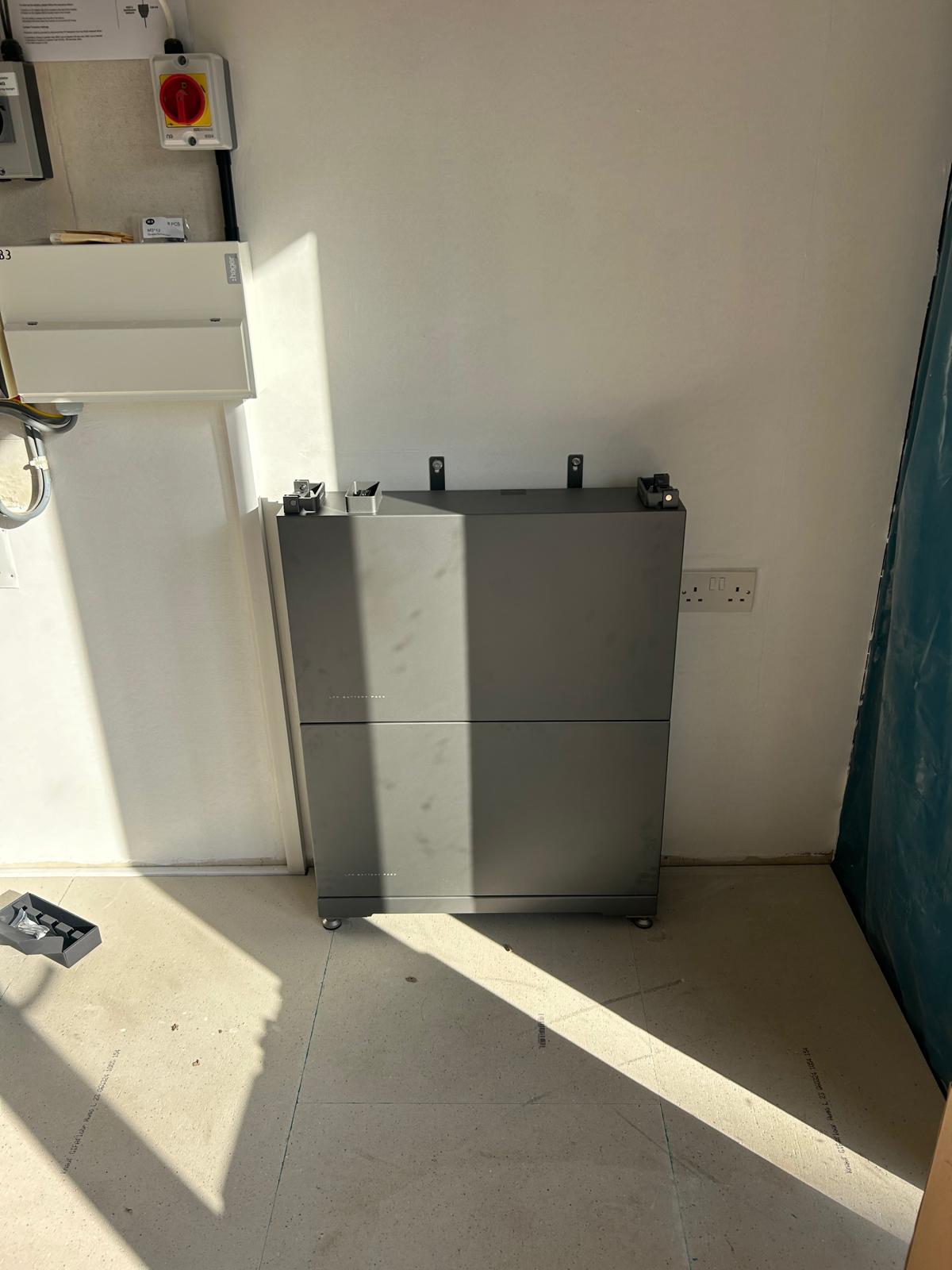 EcoFlow 5kW hybrid battery unit partially installed.