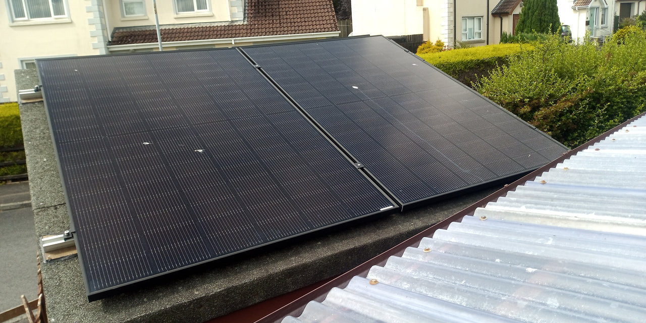 Close-up of solar panels on shed roof